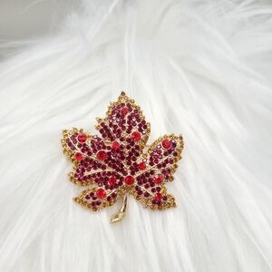 Elegant Gold Leaf Brooch with Red Rhinestones